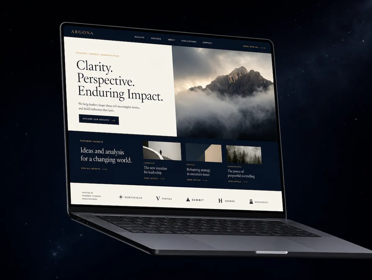 A WordPress-built editorial business website displayed on a laptop